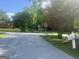 A street view showcasing the neighborhood with tree-lined streets and the surrounding houses at 4109 Francis Ne St, Covington, GA 30014