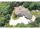Aerial view of an expansive home nestled among lush trees, showcasing its generous lot size at 177 Selfridge Rd, Mcdonough, GA 30252