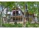 Large rear porch and wood ceiling provides beautiful views of wooded backyard at 177 Selfridge Rd, Mcdonough, GA 30252