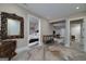 Large basement area featuring open doorways, decorative mirror, pool table, and unique flooring at 177 Selfridge Rd, Mcdonough, GA 30252
