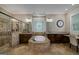The primary bathroom features dual vanities, a soaking tub and a glass walk-in shower at 177 Selfridge Rd, Mcdonough, GA 30252