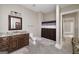 Neutral bathroom with granite vanity, toilet, shower with curtain, and open doorway at 177 Selfridge Rd, Mcdonough, GA 30252