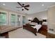 Main bedroom offers a plush rug, ceiling fan and private access to an outdoor balcony at 177 Selfridge Rd, Mcdonough, GA 30252