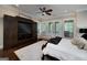 Main bedroom features private access to the outdoor balcony with a cozy chaise lounge at 177 Selfridge Rd, Mcdonough, GA 30252