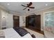 Main bedroom features a TV console with sliding barn doors and private access to the balcony at 177 Selfridge Rd, Mcdonough, GA 30252
