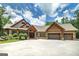 Stunning home with three-car garage, stone accents, and professional landscaping creates an inviting curb appeal at 177 Selfridge Rd, Mcdonough, GA 30252