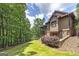 Stunning home exterior with beautiful landscaping, mature trees, and architectural details at 177 Selfridge Rd, Mcdonough, GA 30252
