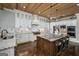 Modern kitchen featuring white cabinets, an eat-in island, and stainless steel appliances perfect for entertaining at 177 Selfridge Rd, Mcdonough, GA 30252