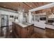 Large kitchen features a center island, stainless steel appliances, and a pass-through to the living room at 177 Selfridge Rd, Mcdonough, GA 30252