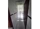 This bathroom features a walk-in shower, black and white mosaic floors, and tiled walls at 1511 Walker Ave, Atlanta, GA 30337