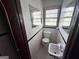 Small bathroom with white tile, classic fixtures and mosaic tile floors at 1511 Walker Ave, Atlanta, GA 30337