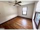 Bright bedroom with hardwood floors and a window bringing in natural light at 1511 Walker Ave, Atlanta, GA 30337