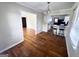 Open-concept dining room with hardwood floors, seamlessly connecting to the kitchen and living areas at 1511 Walker Ave, Atlanta, GA 30337
