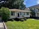 Charming single-story home with a well-maintained lawn, offering a cozy and inviting curb appeal at 1511 Walker Ave, Atlanta, GA 30337