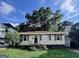 Charming single-story home with mature trees, offering a peaceful and inviting outdoor space at 1511 Walker Ave, Atlanta, GA 30337
