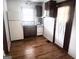 Cozy kitchen with appliances, wood cabinets, and a door to the backyard at 1511 Walker Ave, Atlanta, GA 30337