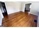 Spacious living room featuring beautiful hardwood floors and seamless access to other living areas at 1511 Walker Ave, Atlanta, GA 30337