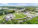 Picturesque aerial view showcases the vibrant community park featuring an amphitheater and green space at 397 Cypher Dr, Suwanee, GA 30024