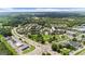 Expansive aerial view showcasing the community layout with parks, commercial areas, and beautiful landscaping at 397 Cypher Dr, Suwanee, GA 30024