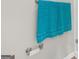 Bright bathroom featuring chrome fixtures, a towel rack, and blue striped towels at 397 Cypher Dr, Suwanee, GA 30024