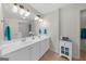 Bathroom with double sink vanity, tile floor, and large mirror at 397 Cypher Dr, Suwanee, GA 30024