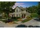 Charming townhome with manicured lawn, a welcoming entrance, and attractive curb appeal in a pleasant neighborhood at 397 Cypher Dr, Suwanee, GA 30024
