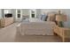 Main bedroom featuring fireplace, sitting area, ceiling fan, and two windows at 397 Cypher Dr, Suwanee, GA 30024