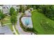 Aerial view of the community pool with lounge chairs and landscaped surroundings in a desirable neighborhood at 397 Cypher Dr, Suwanee, GA 30024