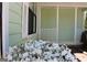 Inviting porch with white railing and blooming flowers at 905 Ohara Dr, Jonesboro, GA 30236