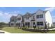 Charming new construction townhomes featuring modern design, well-kept landscaping, and inviting curb appeal at 340 Sound Cir, Stockbridge, GA 30281