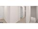 Hallway features neutral carpet and walls, with doors leading to other rooms at 340 Sound Cir, Stockbridge, GA 30281