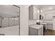 Open kitchen with gray cabinets, granite countertops, and garage view at 340 Sound Cir, Stockbridge, GA 30281