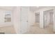 Well-lit carpeted room with a window and doorways, offering a spacious and airy feel at 340 Sound Cir, Stockbridge, GA 30281