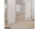 Bright, carpeted room featuring fresh paint and a doorway, creating a welcoming space at 340 Sound Cir, Stockbridge, GA 30281