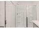 Clean shower with glass doors and convenient built-in shelving for bath essentials at 340 Sound Cir, Stockbridge, GA 30281