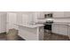Modern kitchen featuring a center island with stainless steel appliances at 348 Sound Cir, Stockbridge, GA 30281