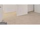 Bright bedroom featuring neutral carpet, white walls, and trim for a calming, minimalist aesthetic at 352 Sound Cir, Stockbridge, GA 30281