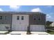 Townhouse exterior featuring two-story design, individual garages, and manicured landscaping at 352 Sound Cir, Stockbridge, GA 30281