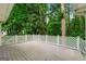 Spacious outdoor back deck offers a peaceful retreat surrounded by lush greenery and mature trees at 4645 Villa Ridge Ne Rd, Marietta, GA 30068