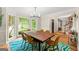 Charming dining room features hardwood floors, natural light, and a rustic wooden table ideal for gatherings at 4645 Villa Ridge Ne Rd, Marietta, GA 30068