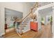 Inviting foyer with hardwood floors, staircase, and decor, creating an elegant and welcoming entrance to the home at 4645 Villa Ridge Ne Rd, Marietta, GA 30068