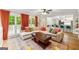 Bright living room featuring large windows, hardwood floors and an open connection to the kitchen at 4645 Villa Ridge Ne Rd, Marietta, GA 30068