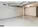 Spacious basement with a finished wall section, offering potential for various uses at 64 Acorn Dr, Dallas, GA 30157
