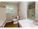 Clean bathroom includes shower, toilet, vanity, and window providing natural light and ventilation at 64 Acorn Dr, Dallas, GA 30157