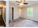 The bedroom offers comfortable carpeting, closet space, and a bright, airy feel from a large window at 64 Acorn Dr, Dallas, GA 30157