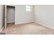 Comfortable bedroom featuring a window and closet space, perfect for relaxation and storage at 64 Acorn Dr, Dallas, GA 30157