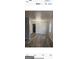 Inviting dining room with a contemporary chandelier, hardwood flooring, and ample space for entertaining at 4634 Bexley Dr, Stone Mountain, GA 30083