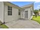 This home has a concrete back patio overlooking the backyard and greenery at 2118 Cherry Tree Ln, Peachtree City, GA 30269