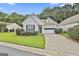 Charming one-story home features a well-manicured lawn, garage and beautiful shutters at 2118 Cherry Tree Ln, Peachtree City, GA 30269