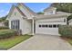 A charming single-story home with a garage and well-maintained landscaping at 2118 Cherry Tree Ln, Peachtree City, GA 30269